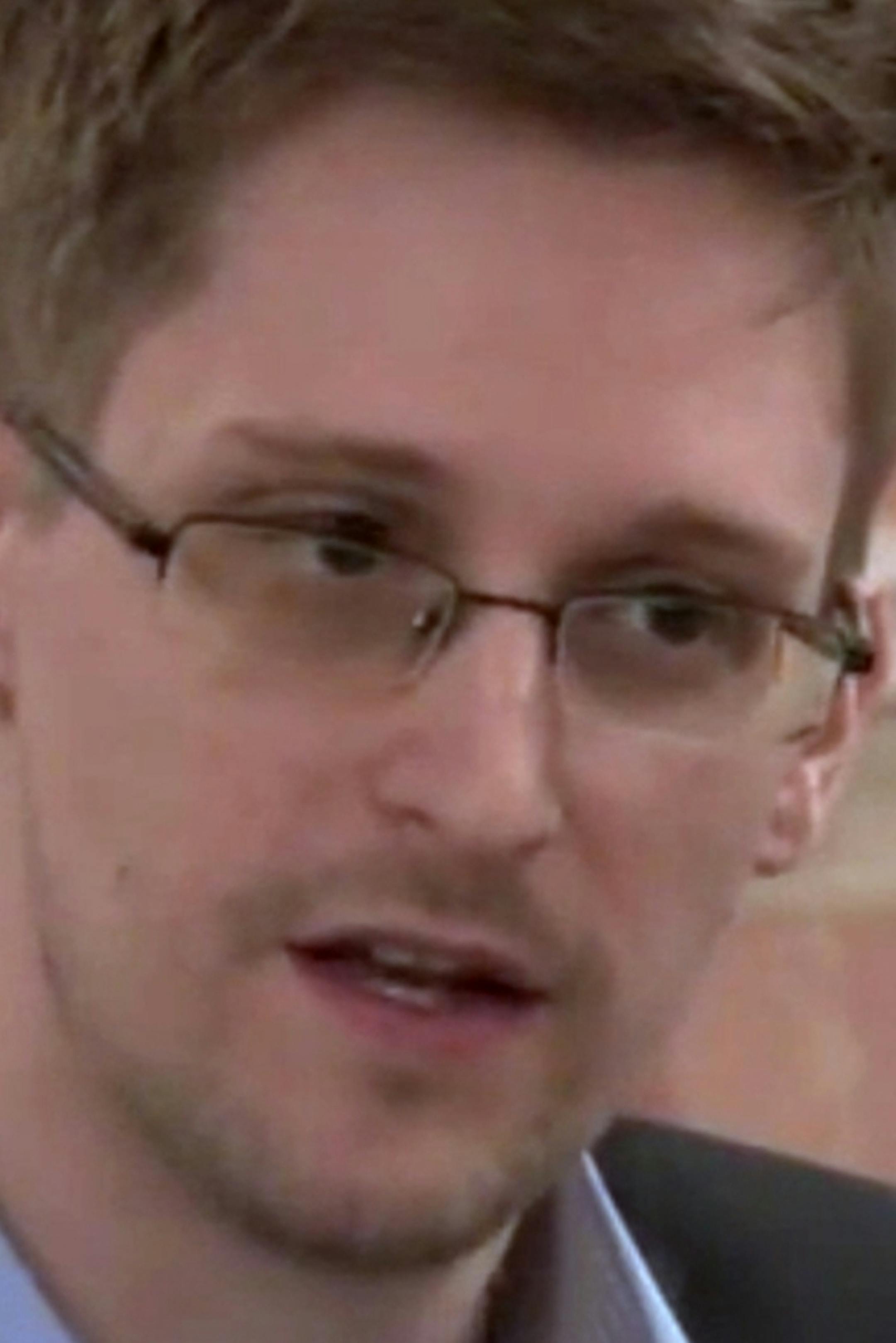 In this image made from video released by WikiLeaks on Friday, Oct. 11, 2013, former National Security Agency systems analyst Edward Snowden speaks during a presentation ceremony for the Sam Adams Award in Moscow, Russia. Should Snowden ever return to the U.S., he would face criminal charges for leaking information about NSA surveillance programs. But legal experts say a trial could expose more classified information as his lawyers try to build a case in an open court that the operations he expo