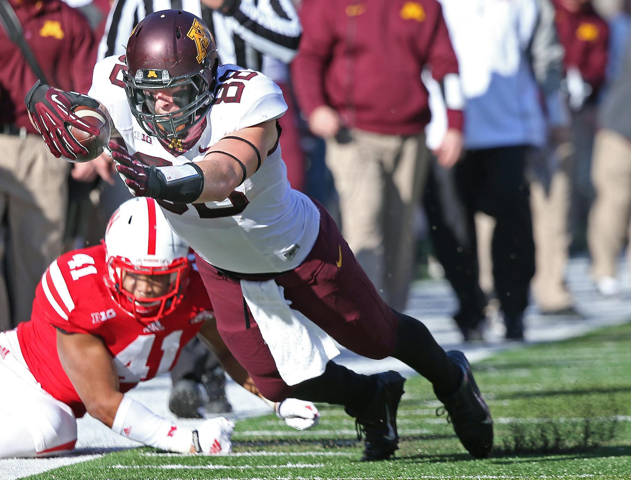 Minnesota tight end Maxx Williams dove just short of the end zone despite defensive pressure by Nebraska linebacker David Santos at Memorial Stadium in November.