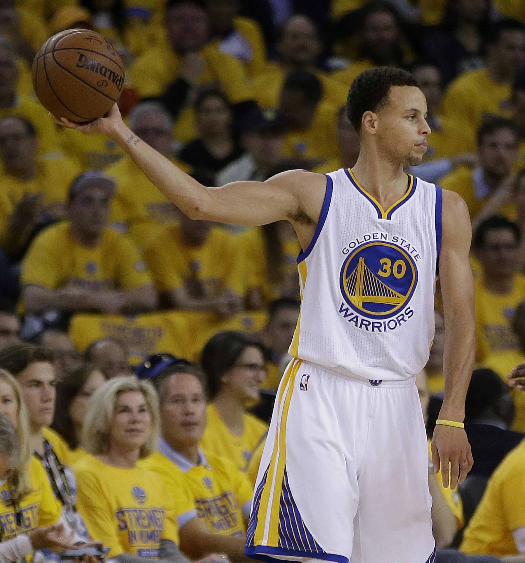 Golden State Warriors guard Stephen Curry (30) holds the ball against Houston Rockets guard Jason Terry during the first half of Game 2 of the NBA basketball Western Conference finals in Oakland, Calif., Thursday, May 21, 2015. (AP Photo/Rick Bowmer)