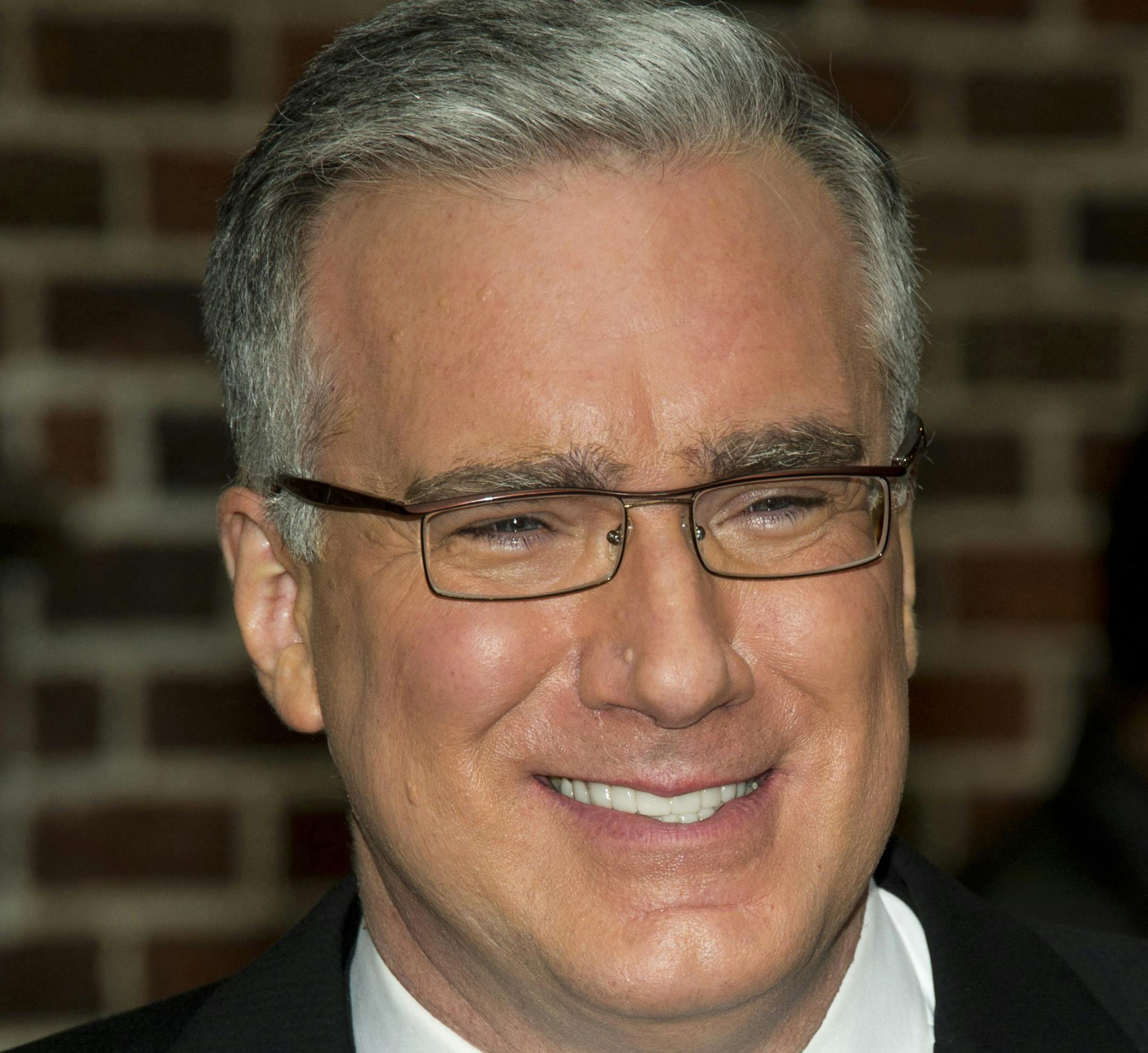 FILE - In this Oct. 24, 2011 file photo, Keith Olbermann leaves a taping of the "Late Show with David Letterman," in New York. Olbermann was taken off his ESPN show for the rest of the week after making insulting comments about Penn State students on Twitter Monday, Feb. 23, 2015. (AP Photo/Charles Sykes, file)
