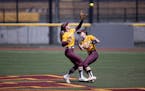 Gopher Delanie Cox left caught a fly ball in front of teammate MaKenna Partain (3) in the second inning.