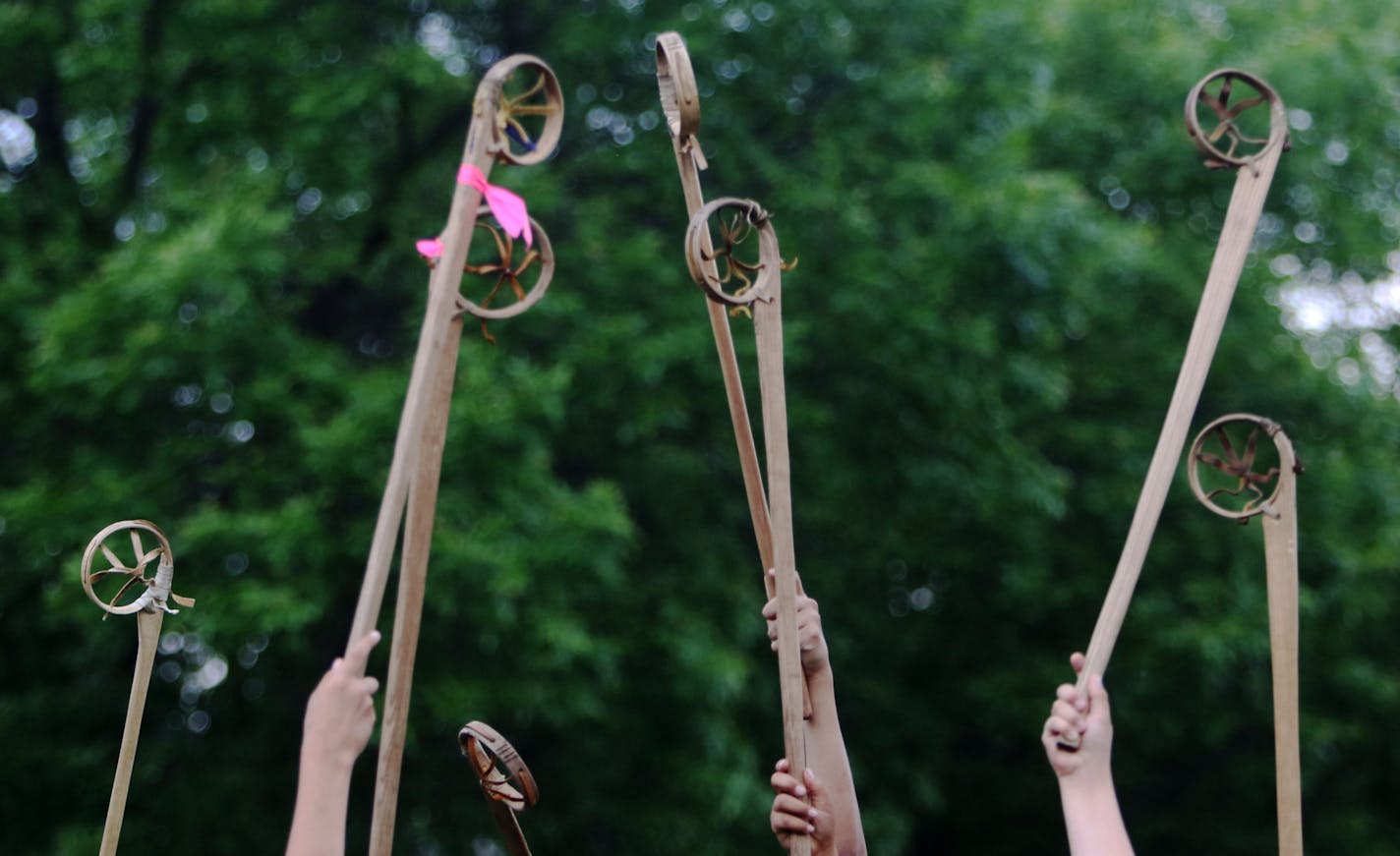 Youth boys team members of Twin Cities Native Lacrosse raise their sticks skyward during the face off during practice at Corcoran Park Wednesday, June 17, 2015, in Minneapolis, MN. The traditional Lacrosse players, who play with hand carved ash sticks, were preparing for the upcoming Twin Cities Native Lacrosse Tournament at the Osseo High School Saturday. ](DAVID JOLES/STARTRIBUNE)djoles@startribune.com Though the sport of lacrosse was originated by native Americans, it's more often associated