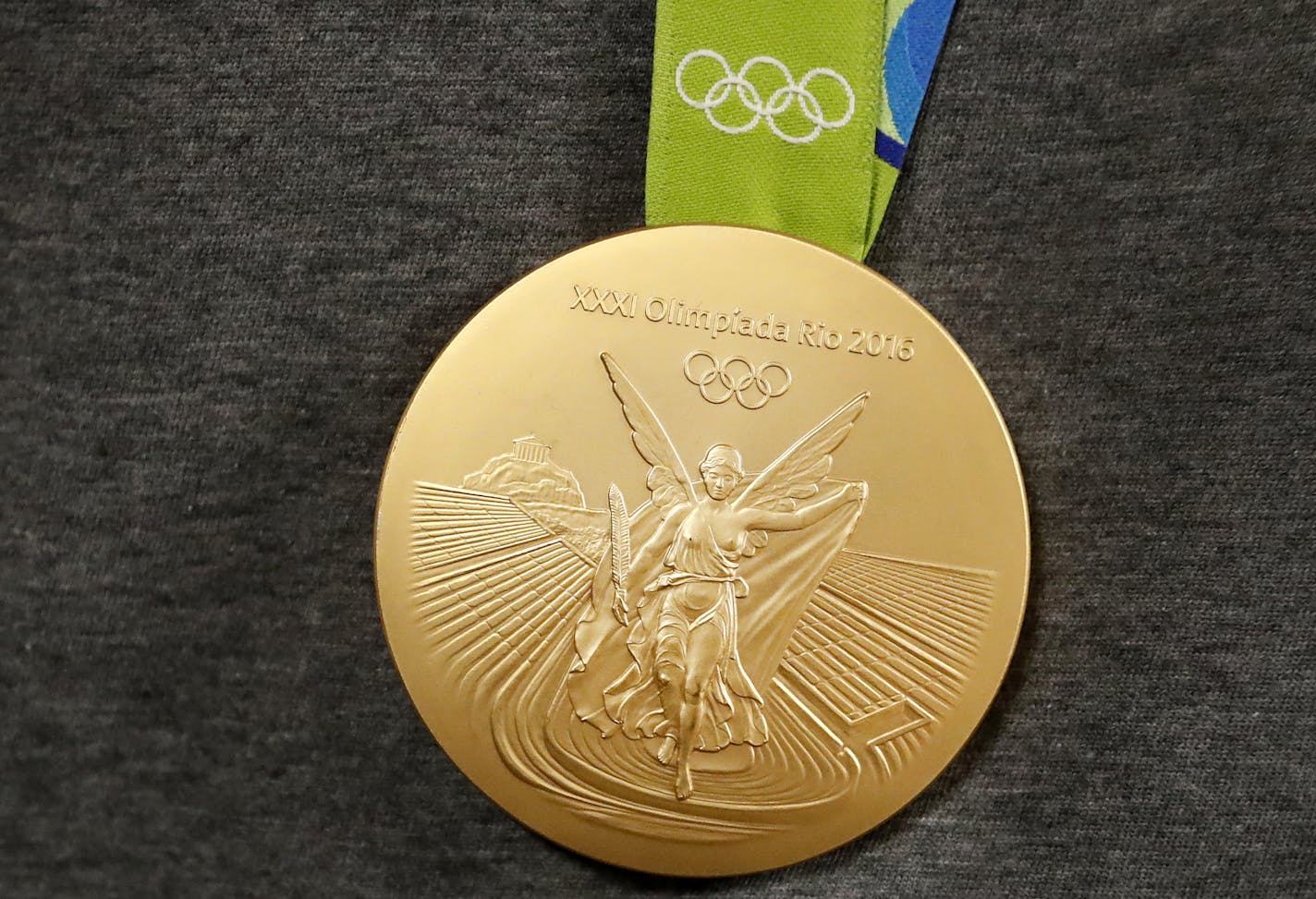 An Olympic Gold Medal worn by Maya Moore. ] CARLOS GONZALEZ cgonzalez@startribune.com - August 22, 2016, Minneapolis, MN, MSP Airport, Four members of the Minnesota Lynx and coach Cheryl Reeve arrive home from the Olympics. Gold Medal Women&#xed;s Basketball