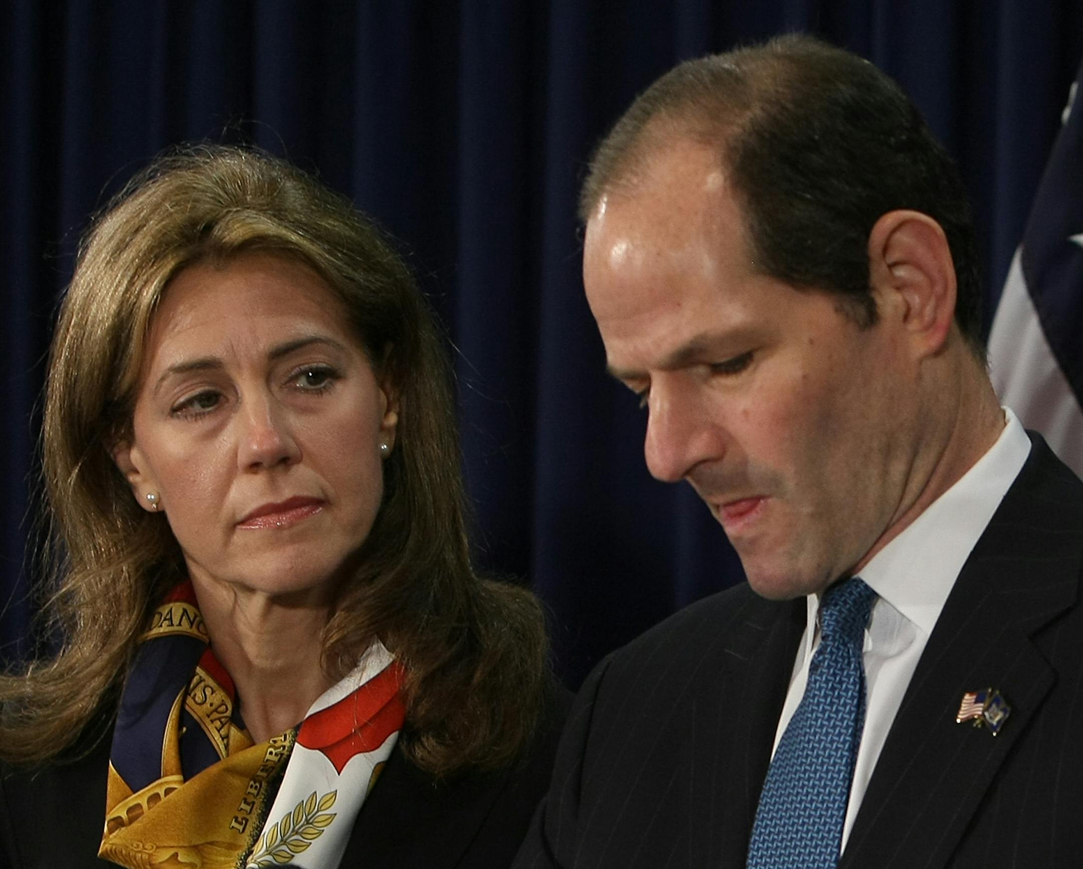 New York Governor Eliot Spitzer addresses the media with his wife Silda at his office in New York Wednesday to announce that he will resign from office after revelations that he had been a client of a prostitution ring.