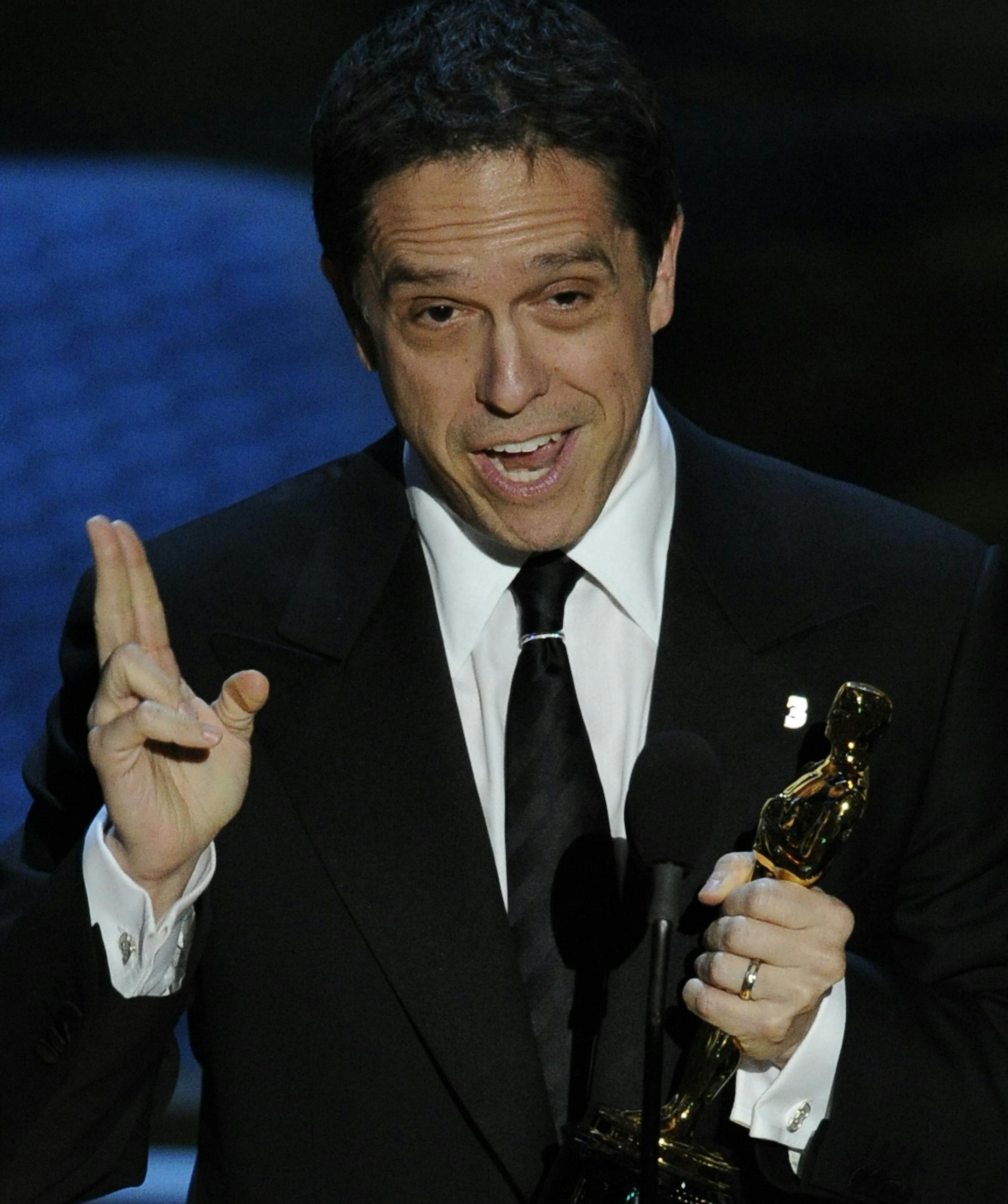 Lee Unkrich accepts the Oscar for best animated feature film for "Toy Story 3" at the 83rd Academy Awards on Sunday, Feb. 27, 2011, in the Hollywood section of Los Angeles. (AP Photo/Mark J. Terrill) ORG XMIT: MIN2013022514253840