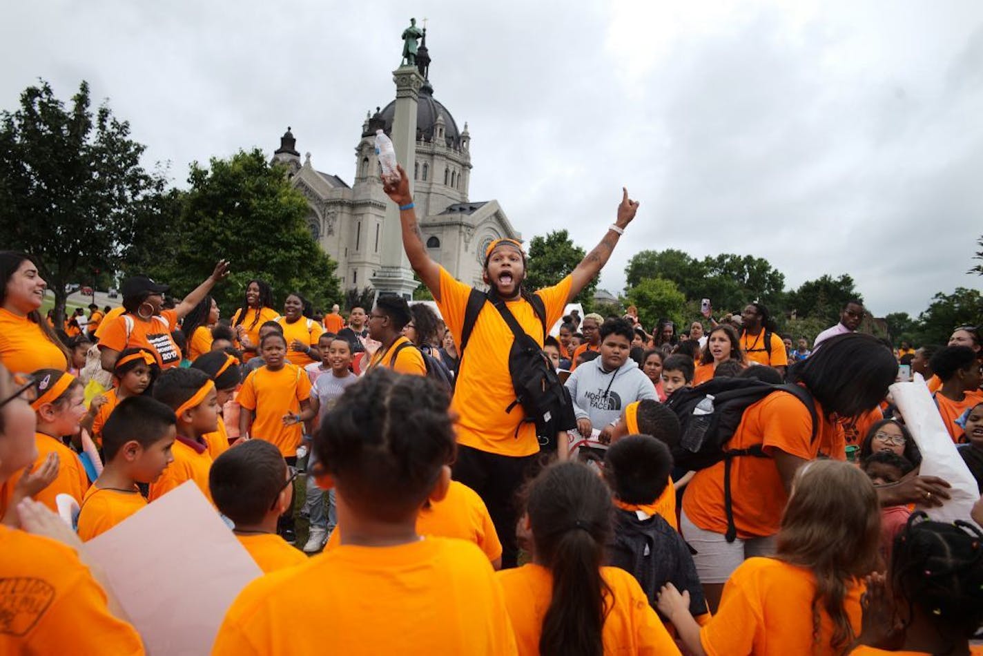 Kids from the St. Paul City School join in a cheer before marching to the Capitol against gun violence.