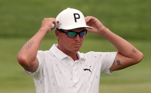 Rickie Fowler adjusted his sunglasses Friday at the 3M Open at the TPC Twin Cities.