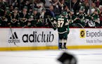 Kirill Kaprizov (97) of the Minnesota Wild celebrates with the bench after his third goal of the game for a hat trick in the third period Tuesday, May