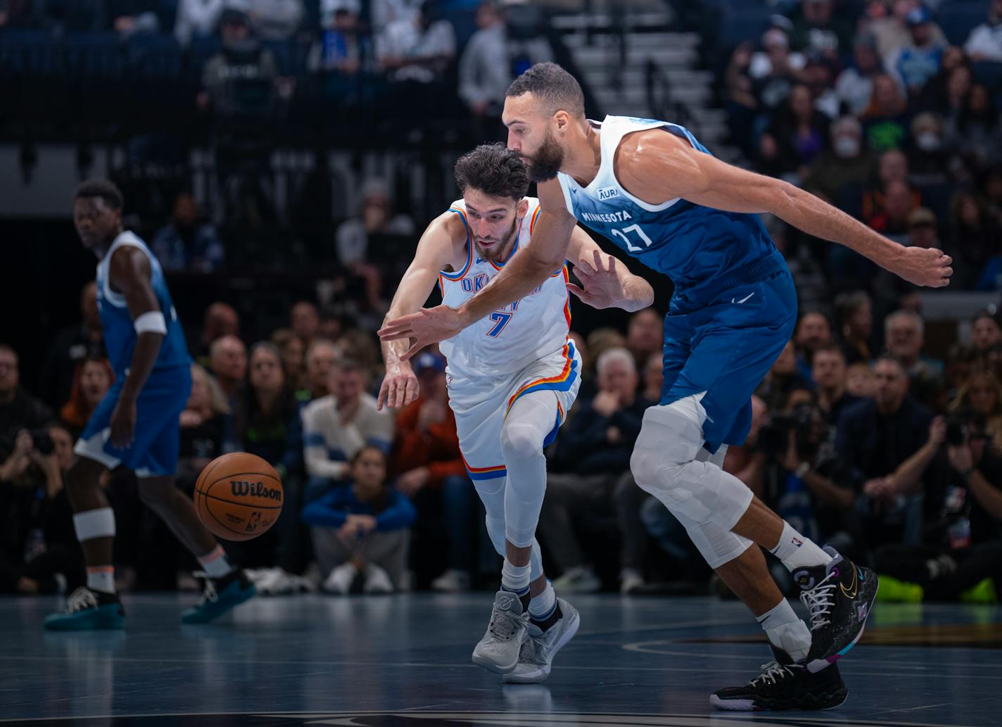 Minnesota Timberwolves center Rudy Gobert (27) stripped the ball from Oklahoma City Thunder forward Chet Holmgren (7) in the first quarter. The Minnesota Timberwolves faced the Oklahoma City Thunder in an NBA basketball game Tuesday night, November 28, 2023 at Target Center in Minneapolis. ] JEFF WHEELER • Jeff.Wheeler@startribune.com