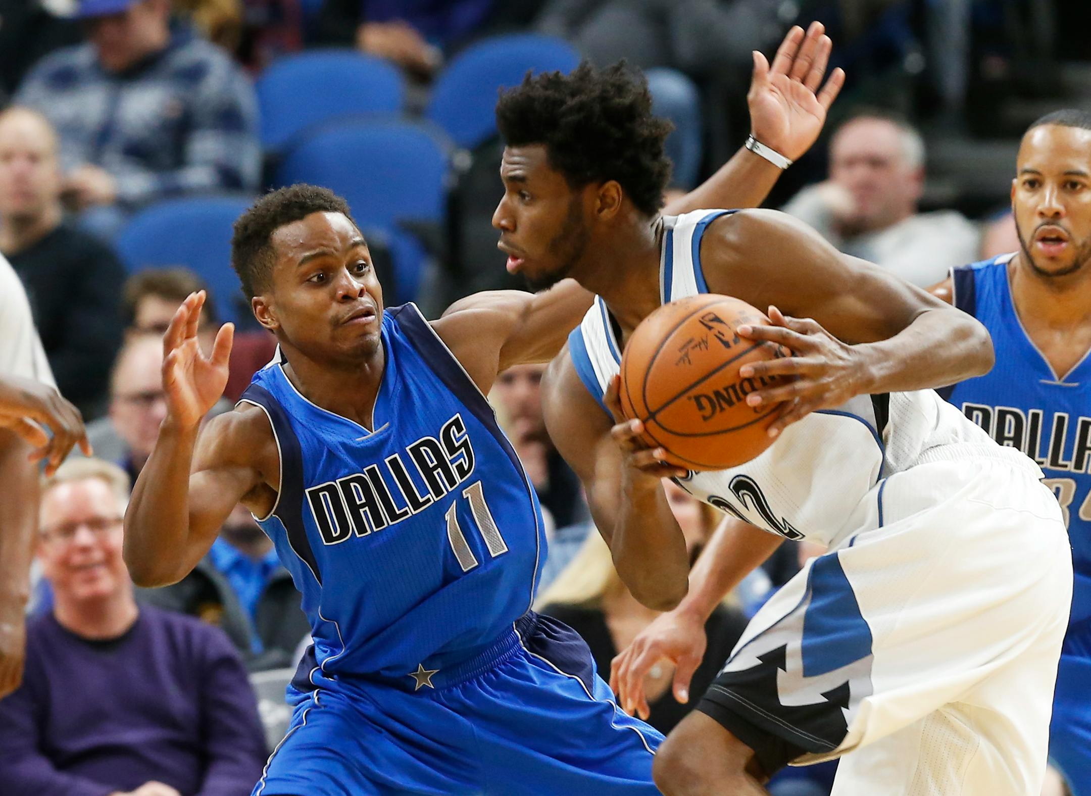 Minnesota Timberwolves' Andrew Wiggins, right, drives around Dallas Mavericks' Yogi Ferrell during the second half of an NBA basketball game Friday, Feb. 24, 2017, in Minneapolis. (AP Photo/Jim Mone)