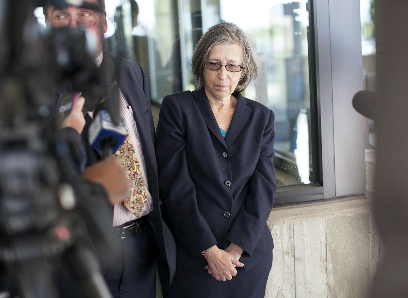 Janis Landis, right, president of Final Exit Network, and defense attorney Robert Rivas, talk with the media after the sentencing of Final Exit Network in the case of the assisted suicide death of Doreen Dunn at the Dakota County Judicial Center in Hastings August 22, 2015. (Courtney Perry/Special to the Star Tribune)