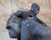Baby gorilla Jengo relaxes on the back of his mother Kibara at the zoo in Leipzig, Germany, Thursday, March 20, 2014. The baby gorilla was born on Dec