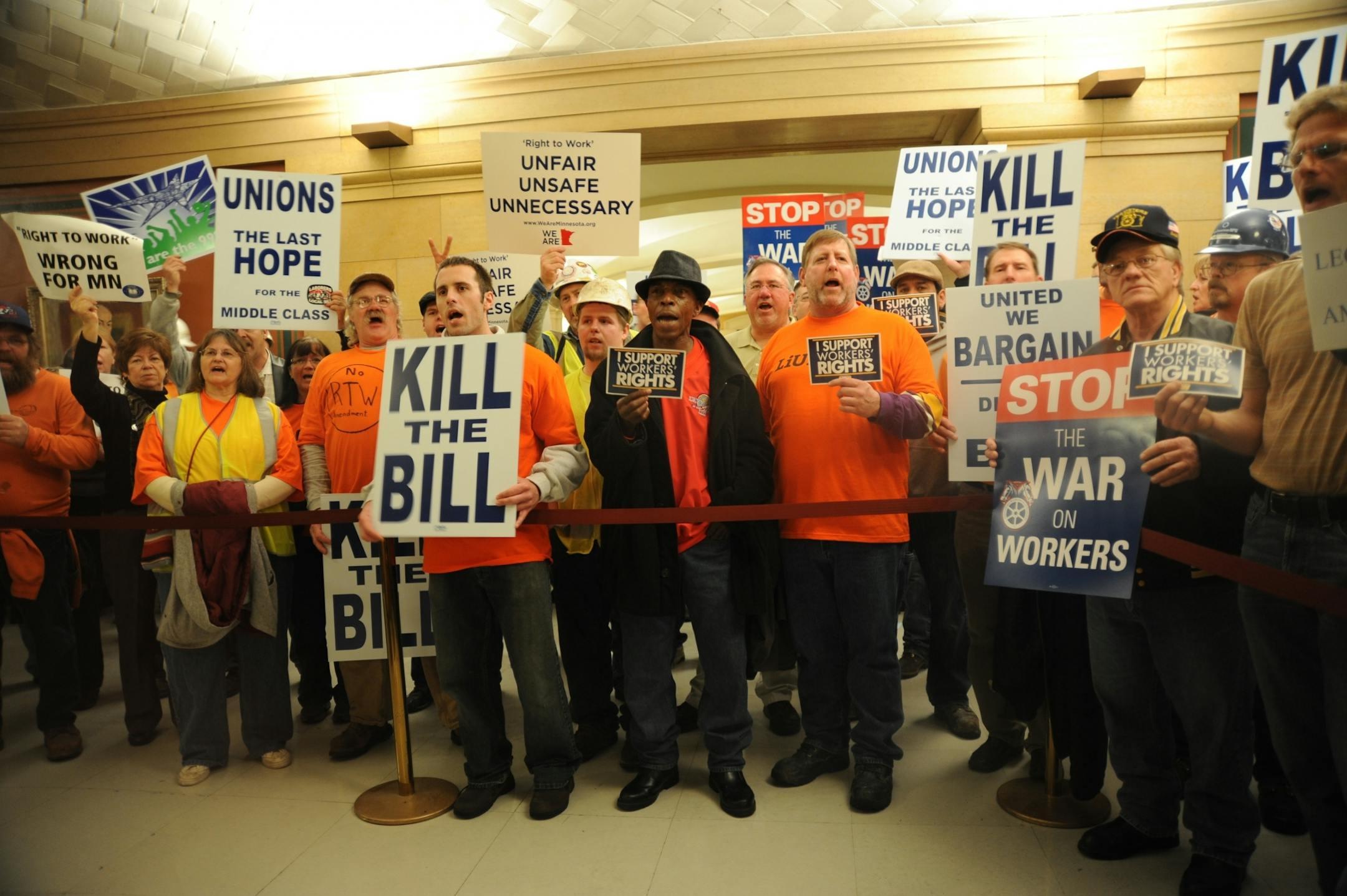 Union members by the hundreds protested outside the Senate Judiciary and Public Safety Committee hearing room at the State Capitol, where a "right to work" bill was getting its first hearing Monday.