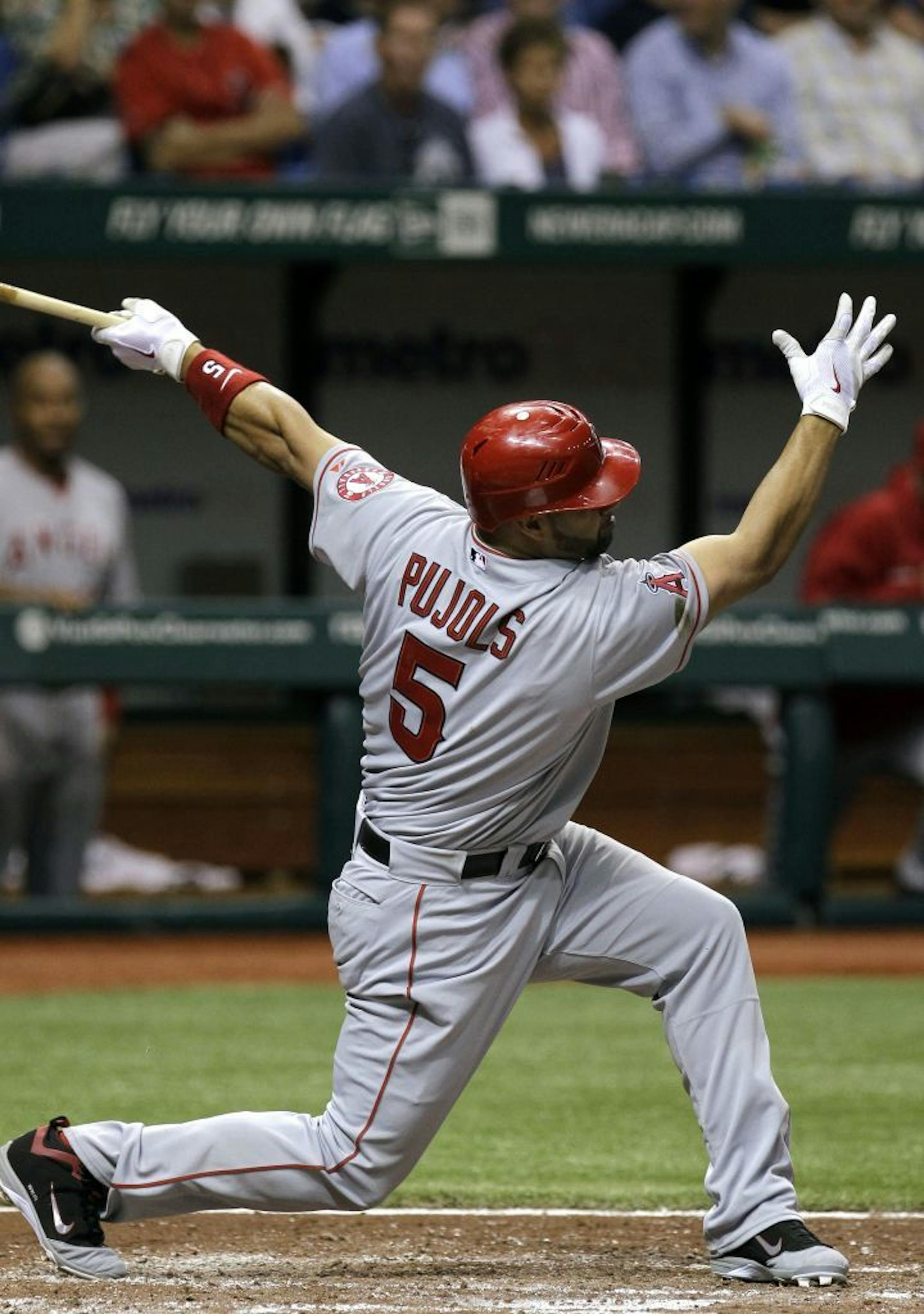 Los Angeles Angels' Albert Pujols takes a wild swing as he strikes out against Tampa Bay Rays starting pitcher Jeremy Hellickson during the third inning of a baseball game, Wednesday, April 25, 2012, in St. Petersburg, Fla.