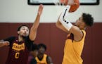 Freshman guard Tre' Williams (shooting against Payton Willis in practice) has shown potential as a long-range shooter for the Gophers, but he needs mi