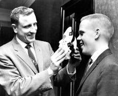 February 23, 1961 Roosevelt Coach Bob Johnson (Left) 'Masks' His Goale Eric Knox will wear plastic faceguard in state tourney February 22, 1961 Februa