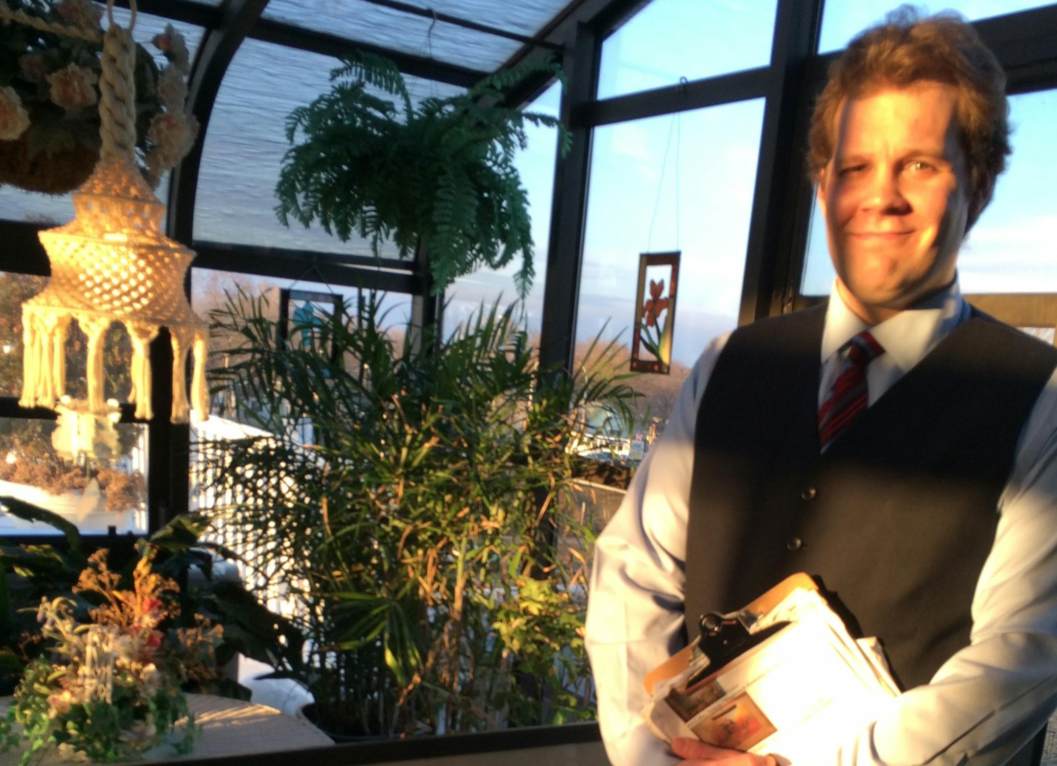 T.J. Jameson, 30, readies for another of his captivating art tours. A piece of his own art, which he calls "Mind Maps" is to his right.