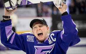 Frost captain Kendall Coyne-Schofield celebrates with the Walter Cup after Minnesota's overtime victory against Ottawa in Game 4 on Monday night.