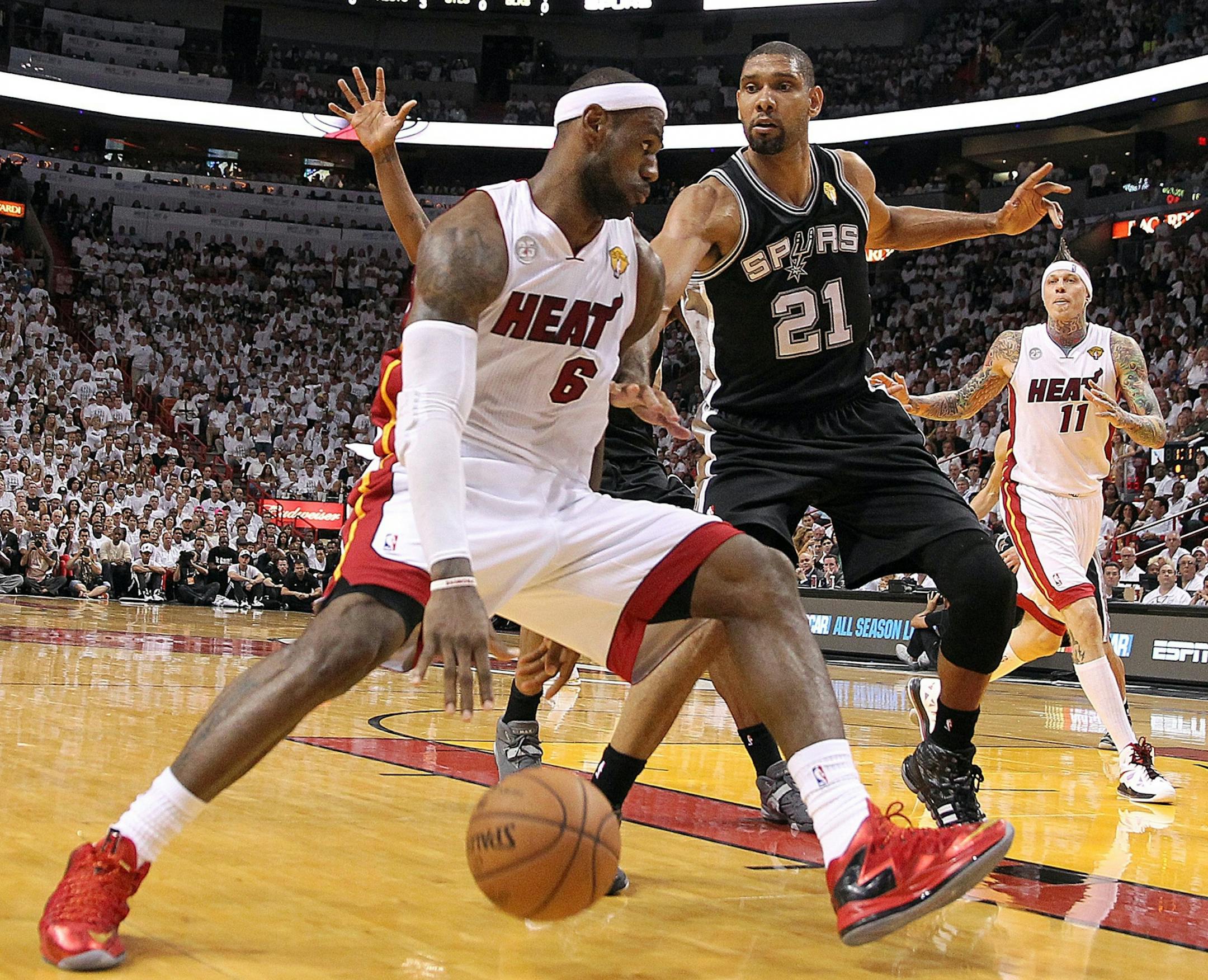 LeBron Jamesdrives to the basket against San Antonio Spurs' Tim Duncan in the third quarter of Game 7 of the NBA Finals