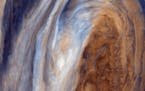 This view of the Great Red Spot is seen in greatly exaggerated color. The colors do not represent the true hues seen in the Jovian atmosphere but have