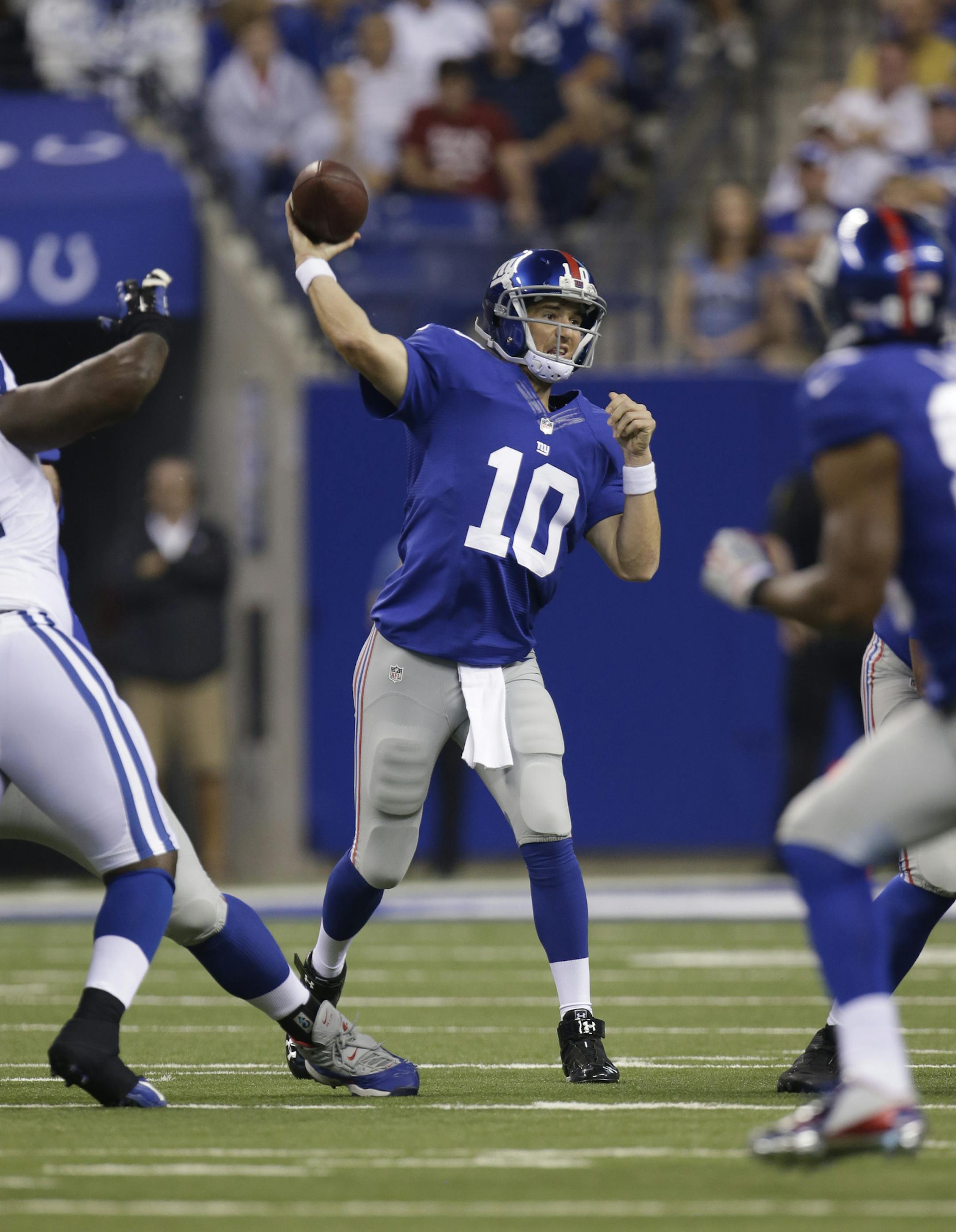 New York Giants' Eli Manning (10) throws during the first half of an NFL preseason football game against the Indianapolis Colts Saturday, Aug. 16, 2014, in Indianapolis. (AP Photo/AJ Mast) ORG XMIT: NAF1
