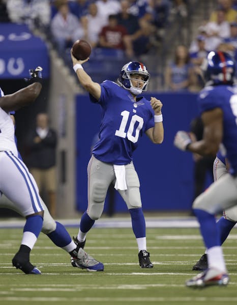 New York Giants' Eli Manning (10) throws during the first half of an NFL preseason football game against the Indianapolis Colts Saturday, Aug. 16, 201