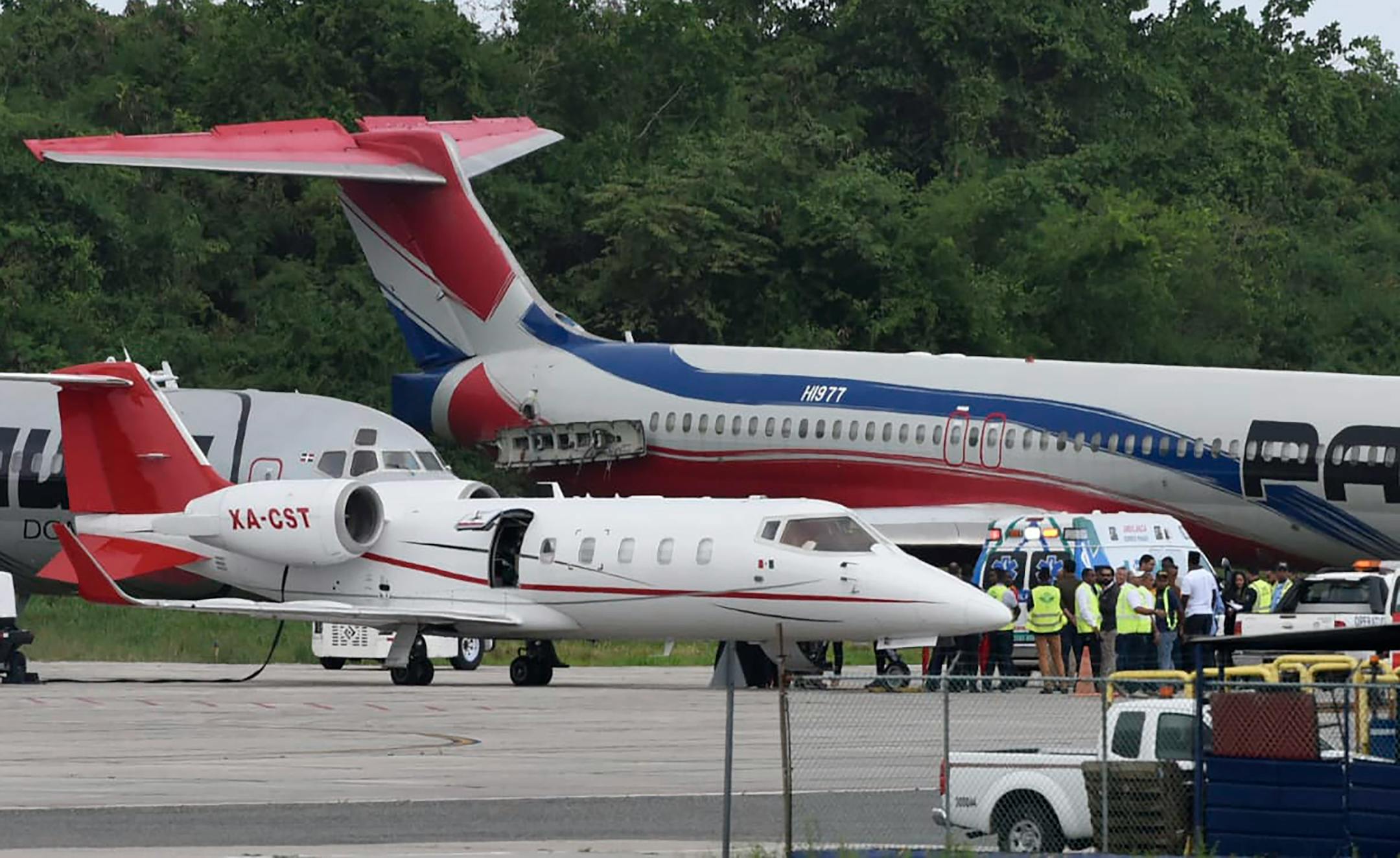 The ambulance carrying former Red Sox slugger David Ortiz was parked next to a small ambulance plane that will fly him to Boston at Las Americas Airport in Santo Domingo, Dominican Republic, on Monday. Doctors removed Ortiz s gallbladder and part of his intestine after the beloved former player known as Big Papi was ambushed the previous day by a gunman at a bar.