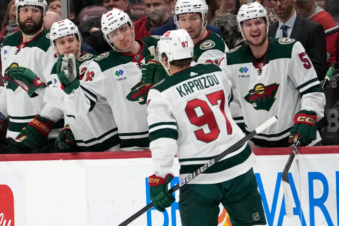 Kirill Kaprizov (97) is congratulated for his goal against the Florida Panthers on Friday.