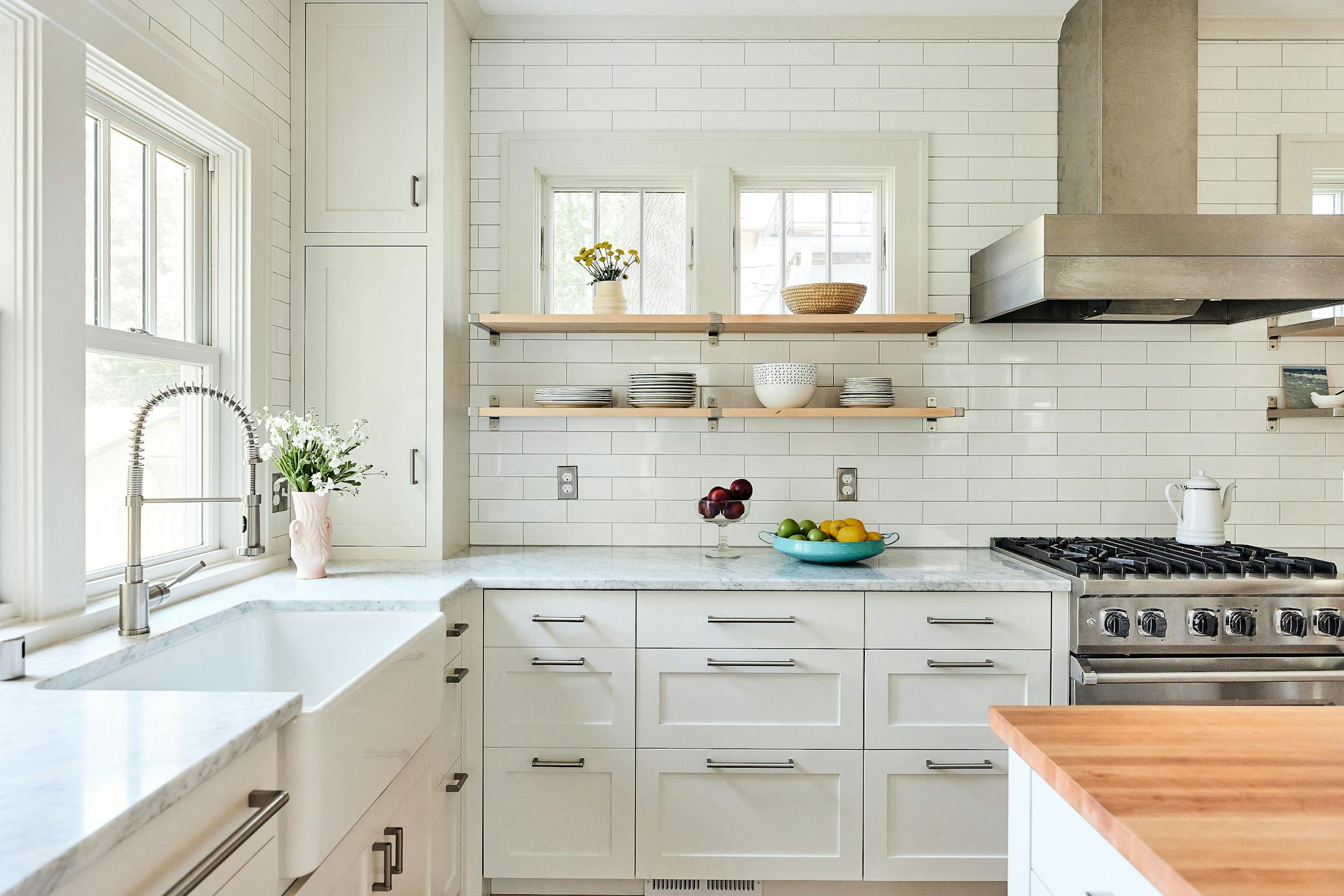 Merriam Park Cottage Renewal, a 2024-2025 Home of the Month winner by Albertsson Hansen Architecture and Interior Design, is a modest 1 1/2-story house that gets an overhaul while maintaining its vintage feel. An addition to a 1916 St. Paul home increases the kitchen’s square footage, adds a small covered porch with easier access to the backyard and expands the second floor to accommodate three bedrooms. Existing spaces are opened up to create better flow between gathering areas. White shaker-style cabinets and trim, as well as tall windows, add airiness and lightness.