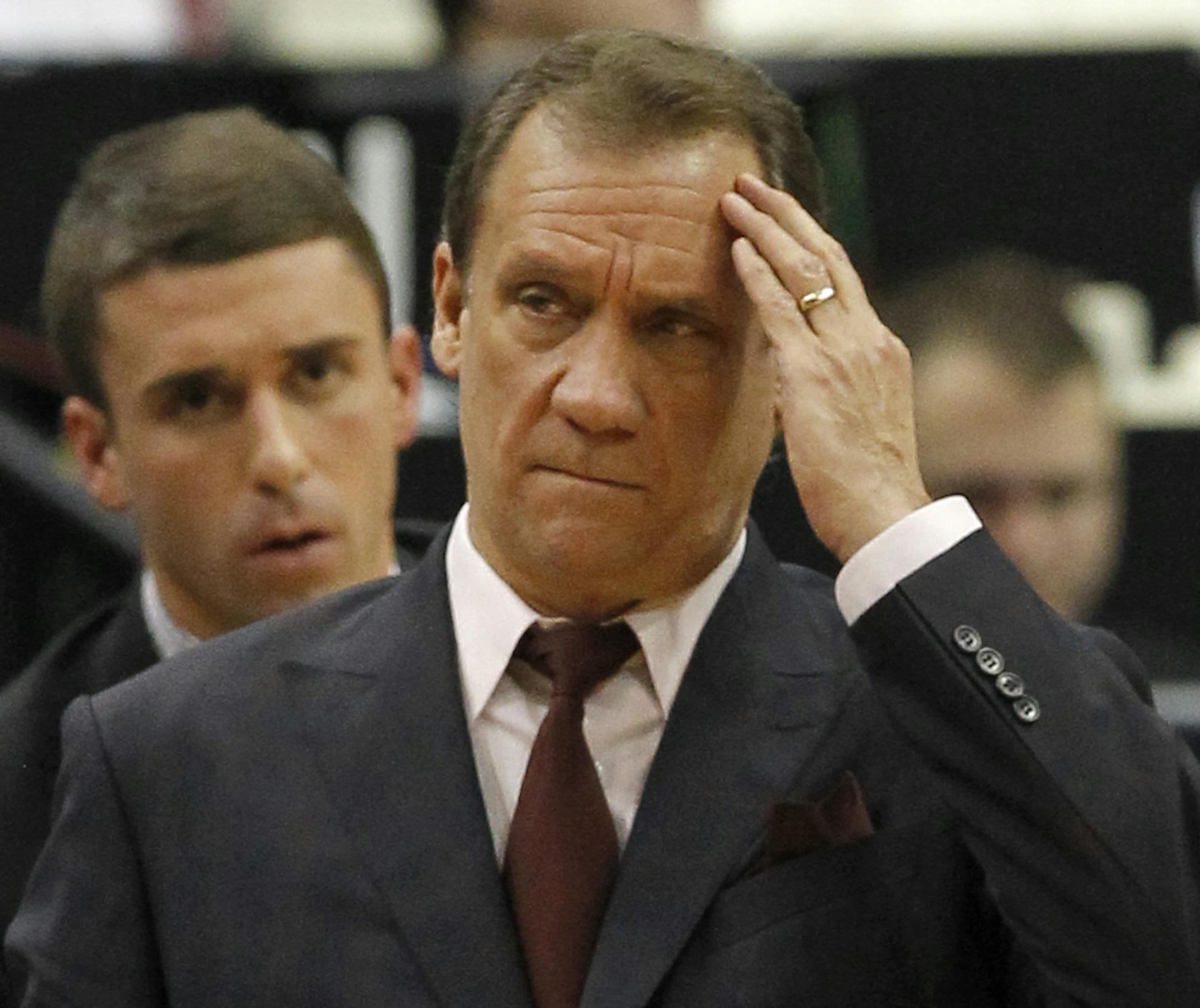 Minnesota Timberwolves head coach Flip Saunders rubs his forehead during the first quarter of an NBA basketball game against the Indiana Pacers in Minneapolis, Sunday, Dec. 21, 2014. (AP Photo/Ann Heisenfelt) ORG XMIT: OTKAH103