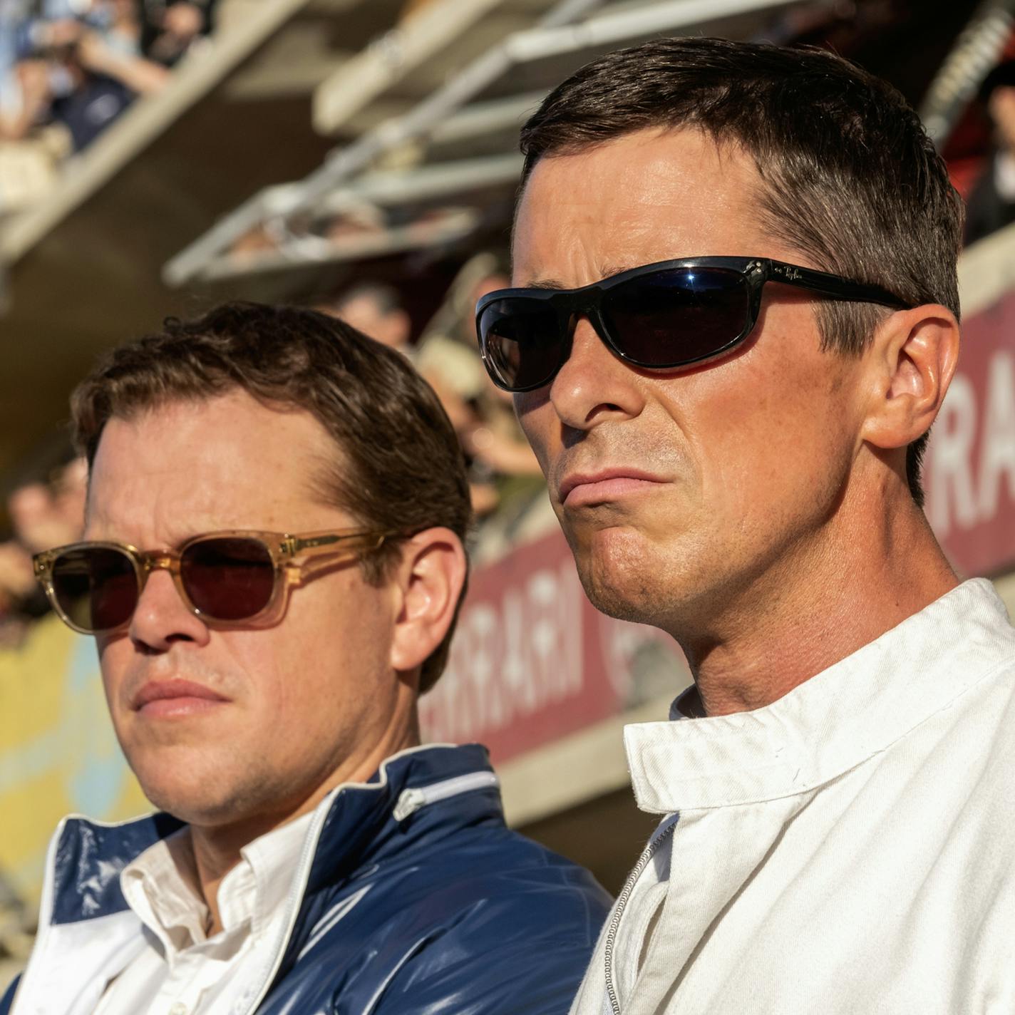 This image released by 20th Century fox shows Christian Bale, right, and Matt Damon in a scene from "Ford v. Ferrari," in theaters on Nov. 15. (Merrick Morton/20th Century Fox via AP)