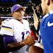 Vikings quarterback Josh Freeman (12) shook hand with Giants quarterback Eli Manning at the end of the game. New York beat Minnesota by a final score 