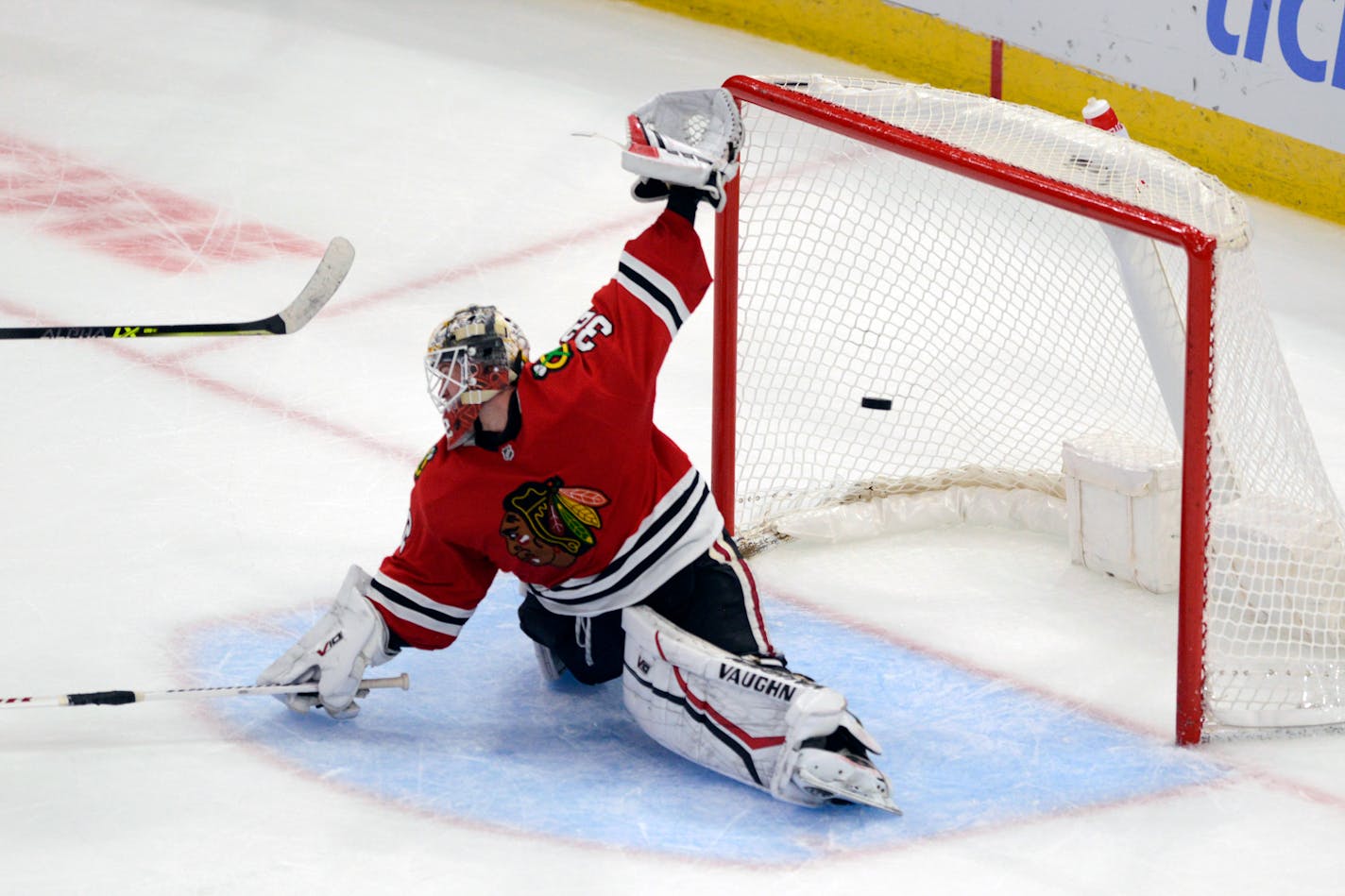 Blackhawks goalie Alex Stalock allows a goal during a shootout with the Wild on Sunday.