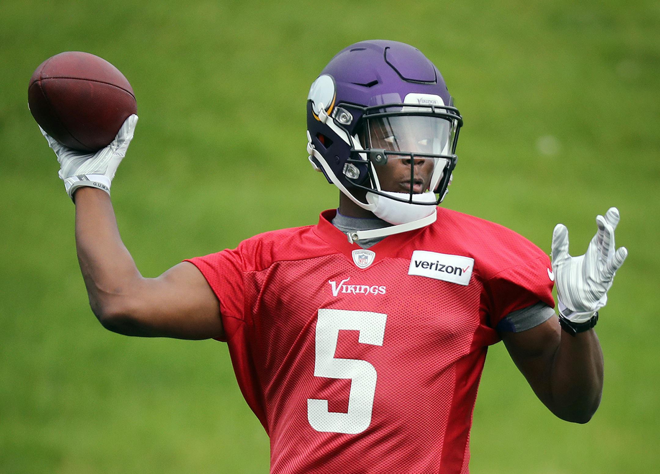 Quarterback Teddy Bridgewater throws the ball during minicamp in Eden Prairie.