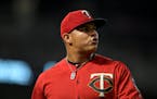 Minnesota Twins relief pitcher Brusdar Graterol (51) walked back to the dugout after pitching in the top of the eighth inning Friday night. ] Aaron La