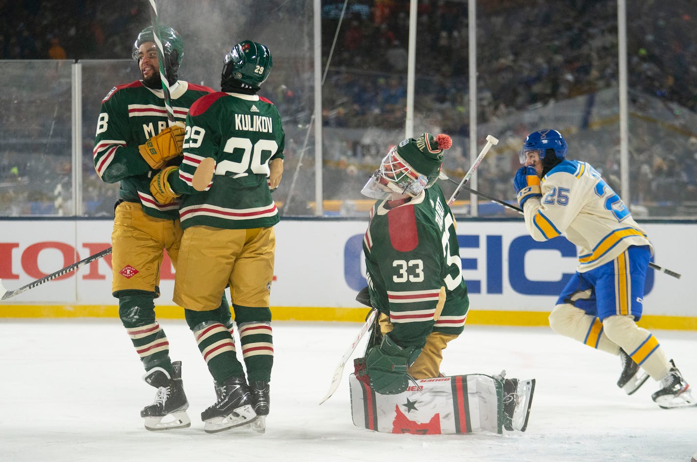 Minnesota Wild goaltender Cam Talbot (33) reacts to letting in his fifth goal of the game in the second period against the St. Louis Blues in the 2022 Winter Classic Saturday, Jan. 01, 2022 in Minneapolis, Minn. ]