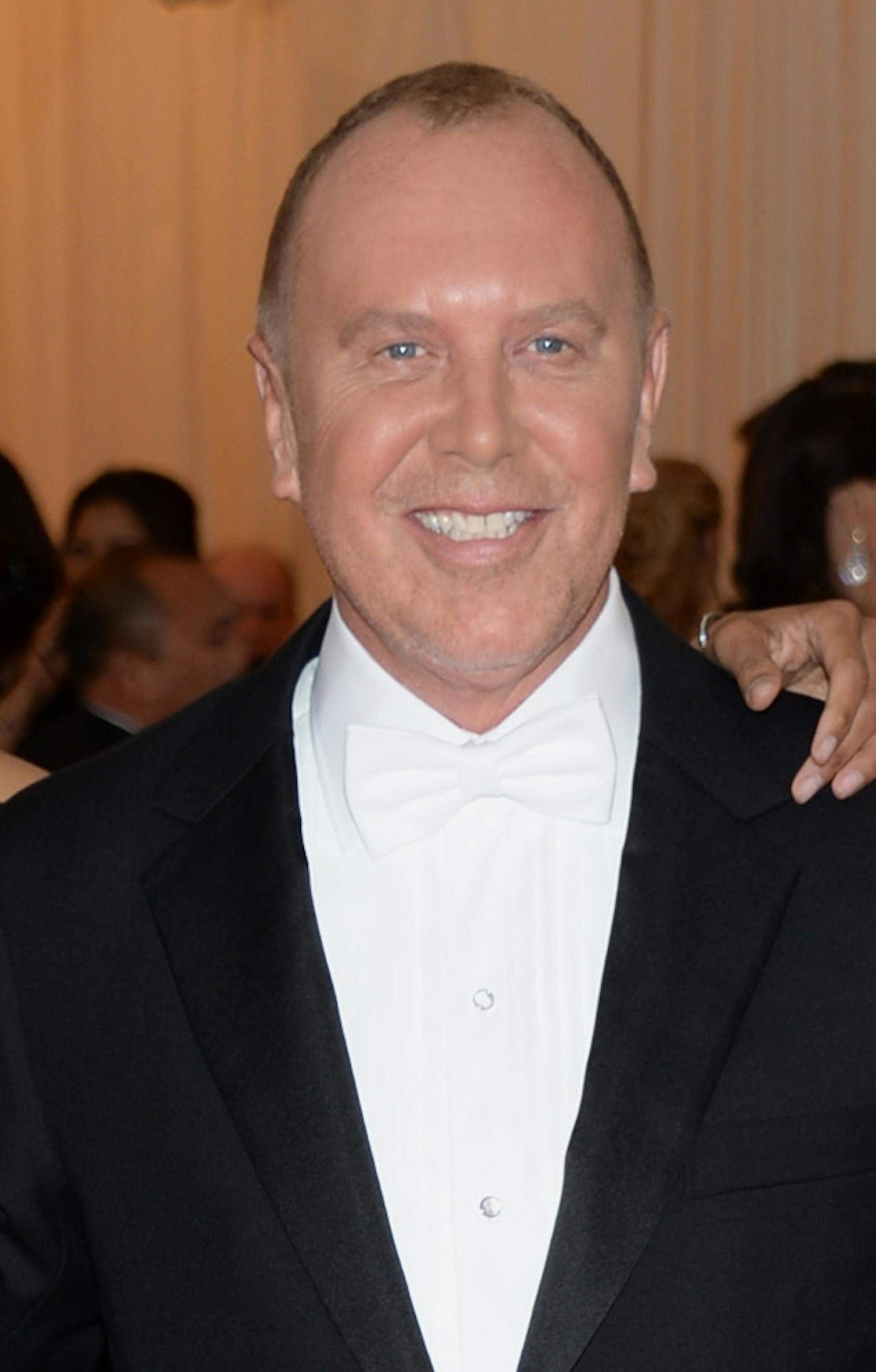 Zoe Saldana, left, and Michael Kors attend The Metropolitan Museum of Art's Costume Institute benefit gala celebrating "Charles James: Beyond Fashion" on Monday, May 5, 2014, in New York. (Photo by Evan Agostini/Invision/AP)