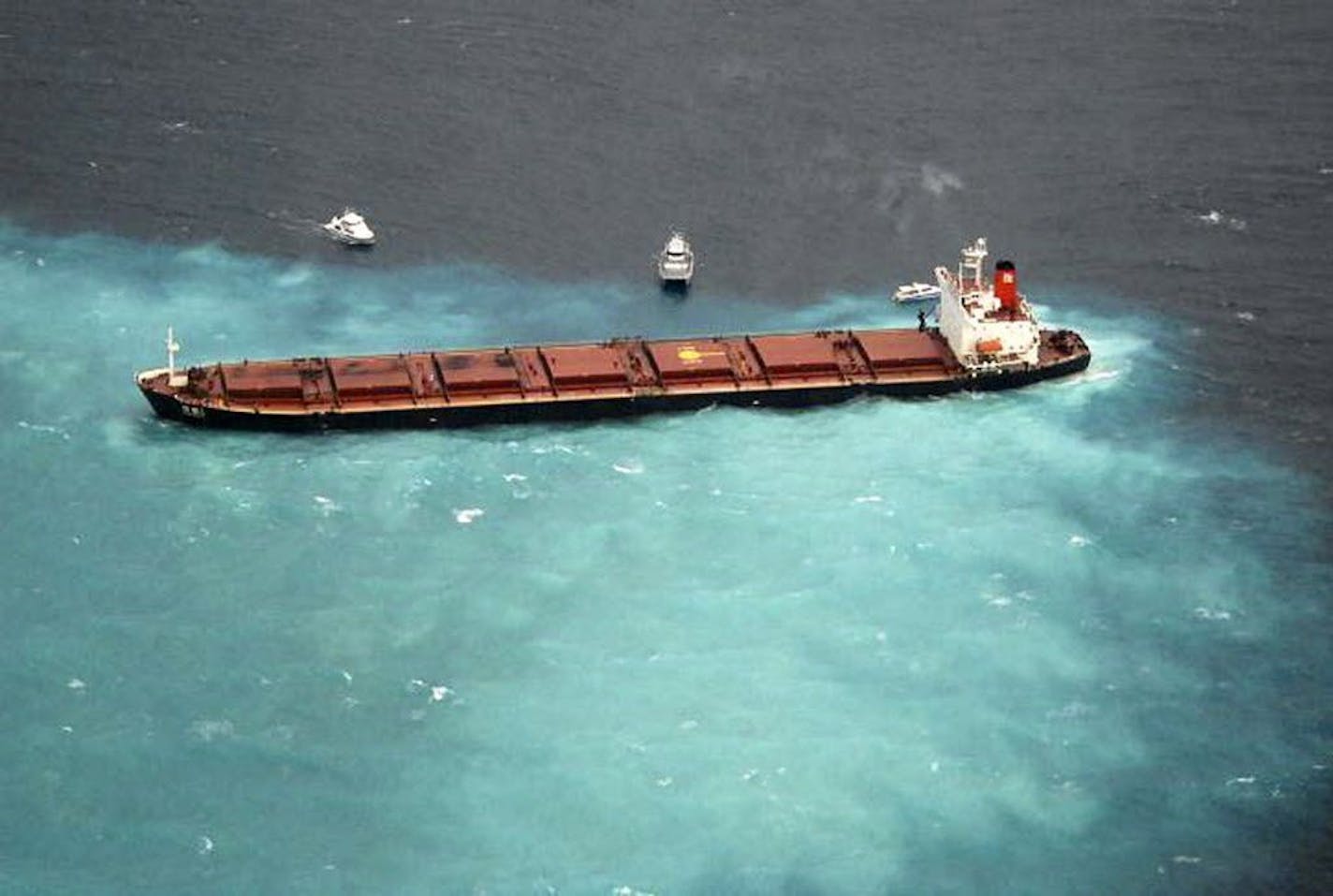 In this image provided by the Australian Maritime Safety Authority, the Chinese carrier Shen Neng 1 is hard aground on the Great Barrier Reef near Great Keppel Island tourist resort, Australia, Sunday, April 4, 2010. The 230 meter (755 foot) bulk carrier was carrying about 65,000 metric tons (72,000 U.S. tons) of coal to China when it ran aground.