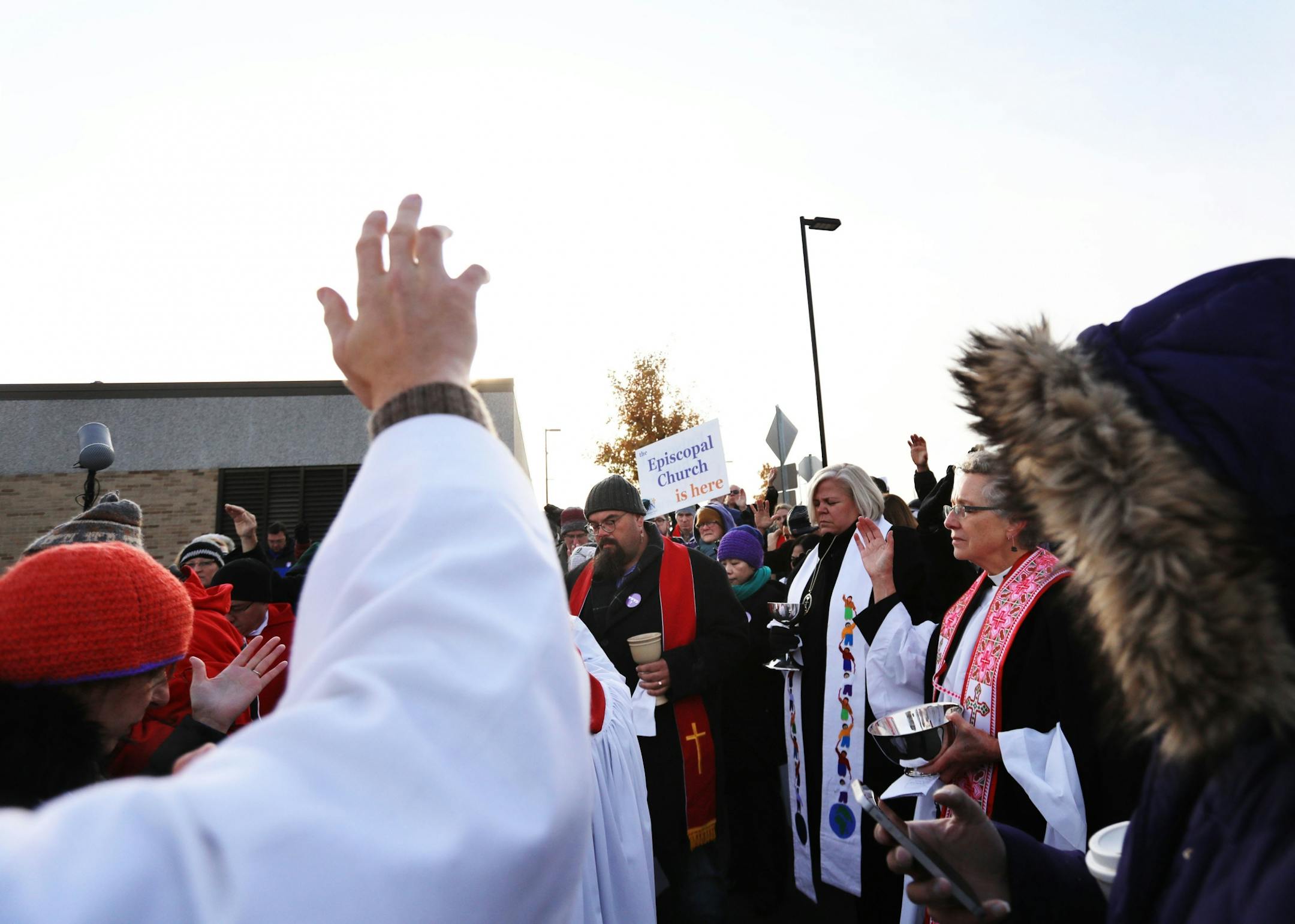 Episcopal clergy as well as clergy of other faiths offered a prayer and blessing to the detainees inside the Whipple Federal Building Tuesday, Oct. 29, 2019, in St. Paul, MN. Clergy and protestors gathered for a service and communion outside the Whipple Federal Building and to protest the naming of the building after the Episcopal bishop because deportations and other actions at the courthouse are in opposition to the beliefs of the Episcopal church, they stated.