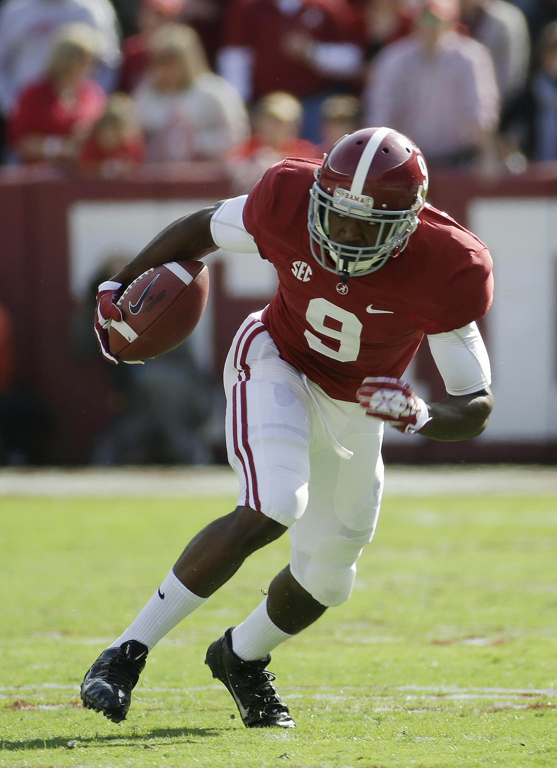 Alabama wide receiver Amari Cooper (9) looks for running room after a reception during the first half of an NCAA college football game against Tennessee in Tuscaloosa, Ala., Saturday, Oct. 26, 2013. (AP Photo/Dave Martin) ORG XMIT: otkdm275