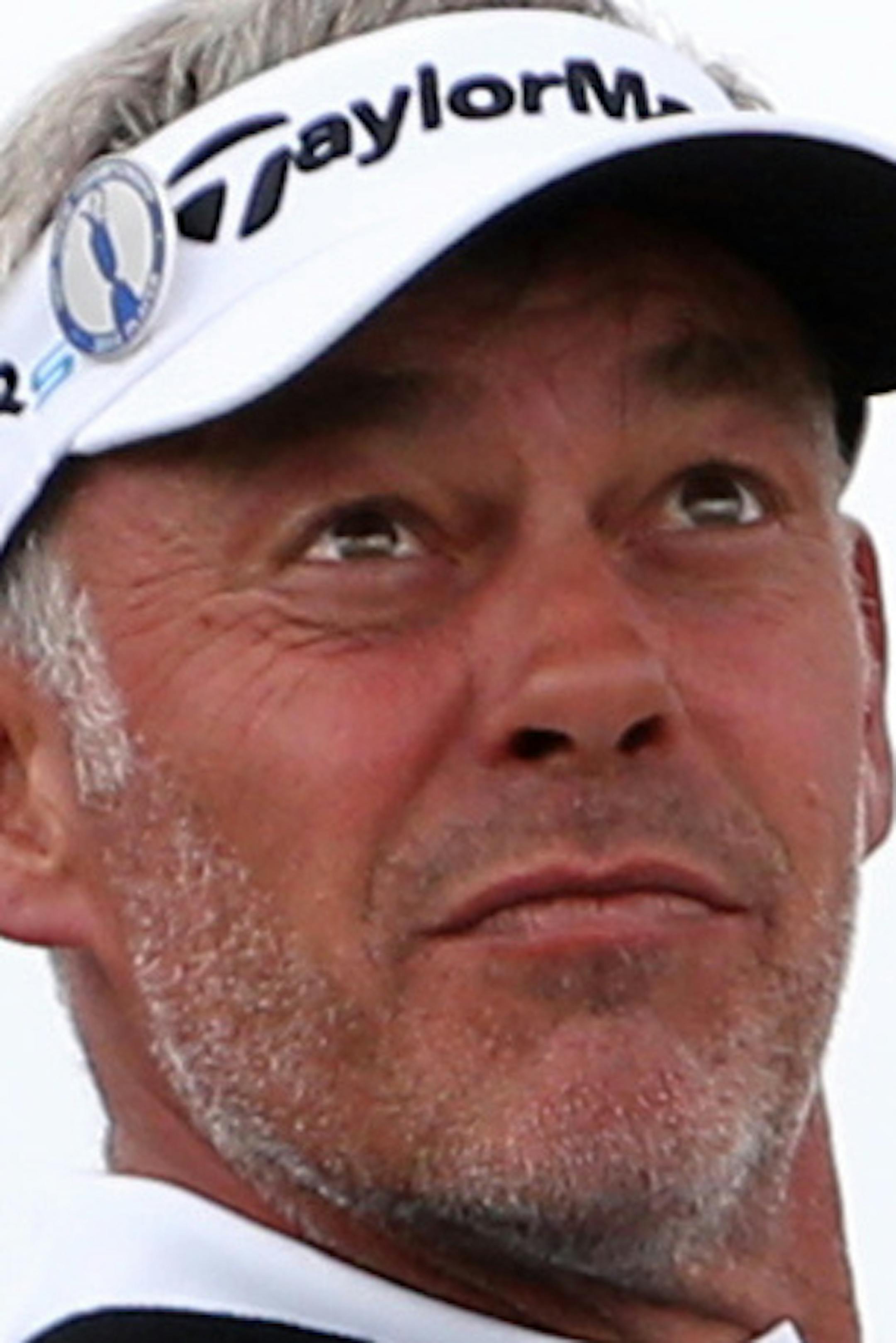 Darren Clarke of Northern Ireland watches his shot off the 15th tee during a practice round ahead of the British Open Golf championship at the Royal Liverpool golf club, Hoylake, England, Wednesday July 16, 2014. The British Open Golf championship starts Thursday July 17. (AP Photo/Scott Heppell)