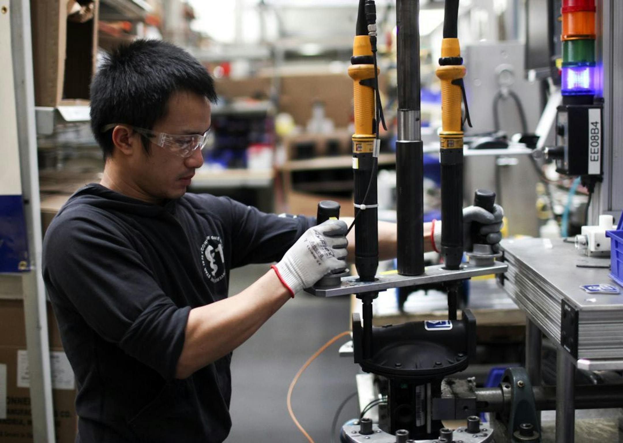 January 2013: Graco assembler Bee Yang works on assembling a diaphragm pump at the Minneapolis plant.