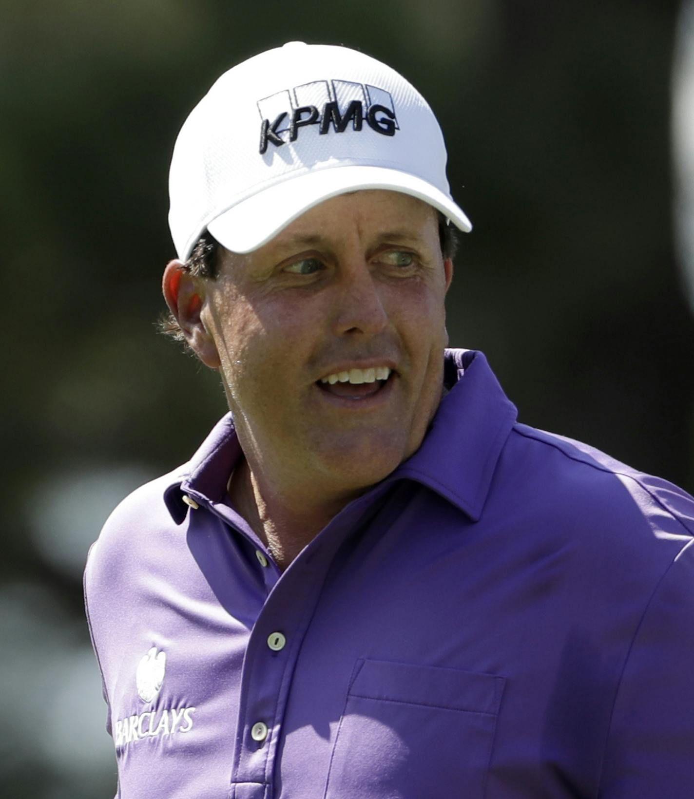 Phil Mickelson reacts after sinking a putt on the first hole during the first round of the Tour Championship golf tournament at East Lake Golf Club in Atlanta, Thursday, Sept. 22, 2016. (AP Photo/David Goldman) ORG XMIT: GADG104