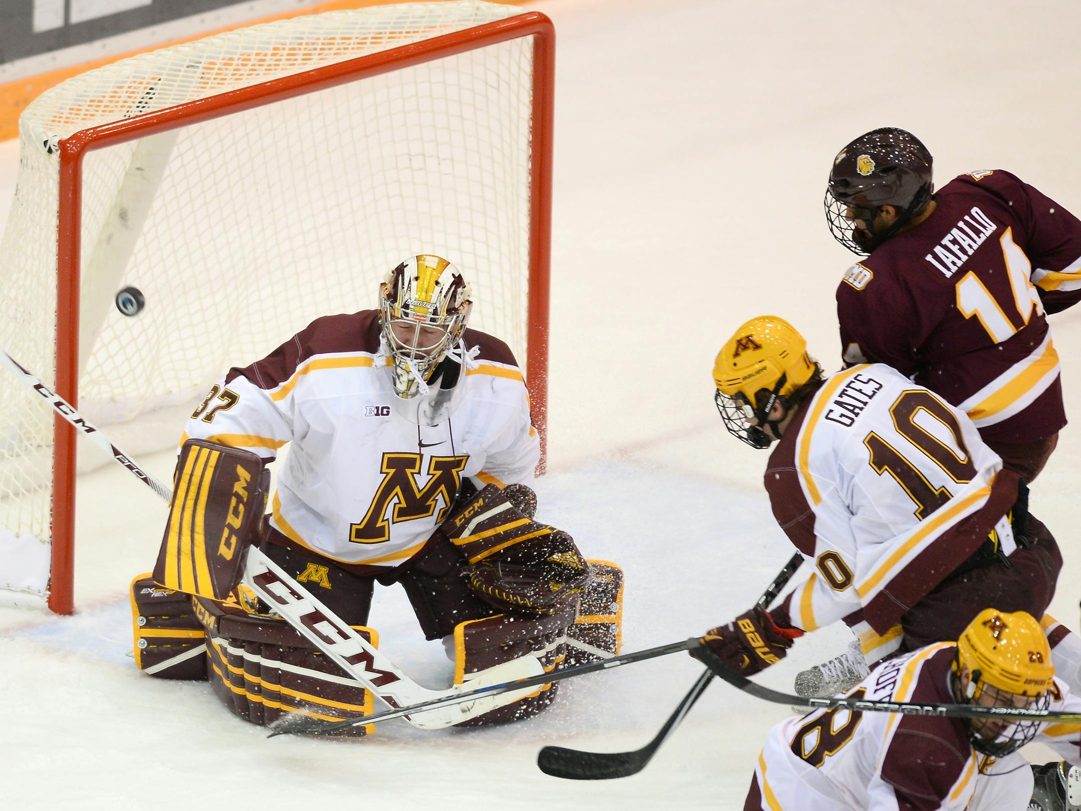 University of Minnesota goalie Eric Schierhorn (37) blocked a shot by University of Minnesota Duluth forward Alex Iafallo (14) in the first period Friday. ] (AARON LAVINSKY/STAR TRIBUNE) aaron.lavinsky@startribune.com The Minnesota Gophers Men's Hockey Team plays the University of Minnesota Duluth Bulldogs on Friday, Oct. 16, 2015 at Mariucci Arena in Minneapolis, Minn.