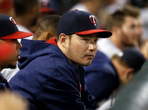 Minnesota Twins' Byung Ho Park, of South Korea, watches teammates during the eighth inning of a baseball game against the Chicago White Sox in Chicago