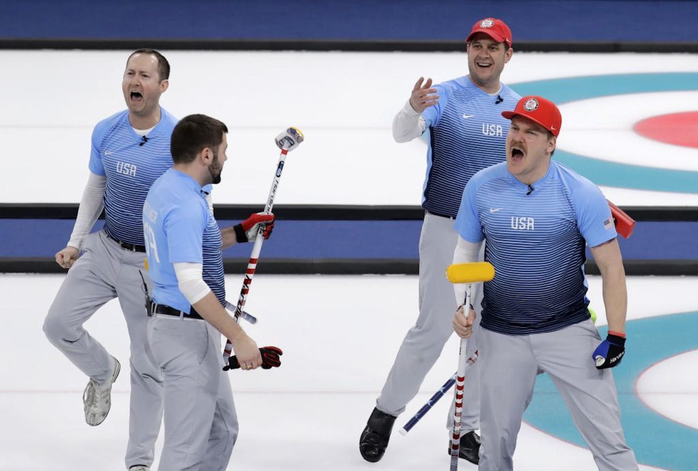 United States' team celebrates after defeating Canada during the men's curling semi-final match at the 2018 Winter Olympics in Gangneung, South Korea, Thursday, Feb. 22, 2018.