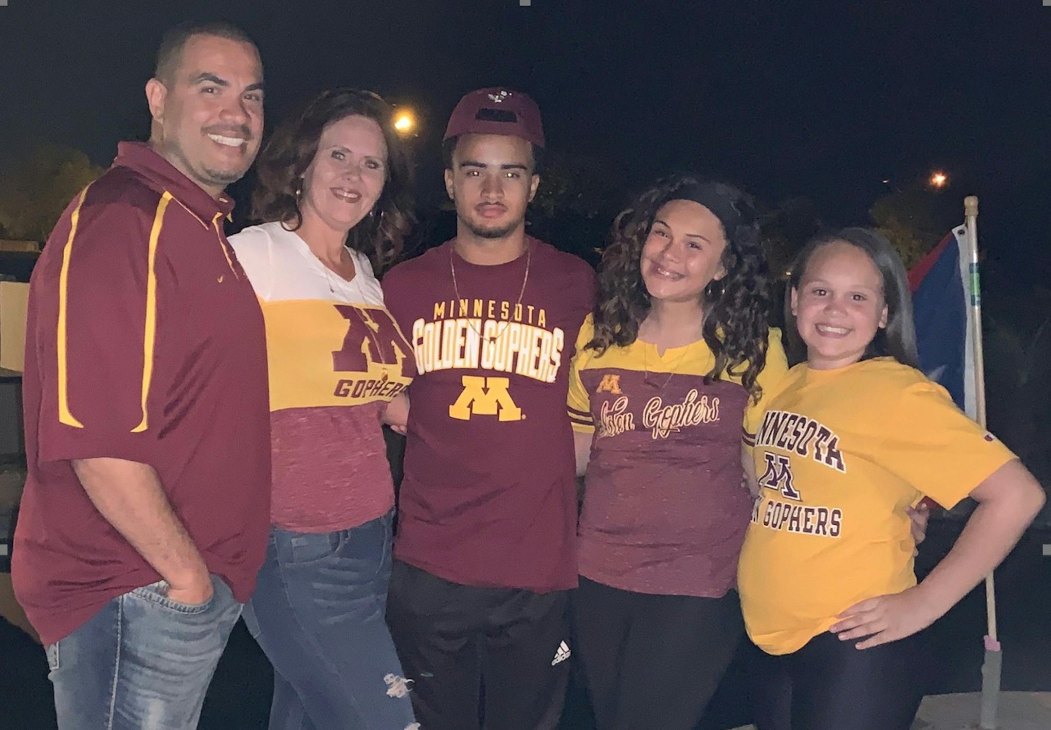 Gophers recruit Steven Ortiz Jr. with his family after committing to Minnesota in April.
