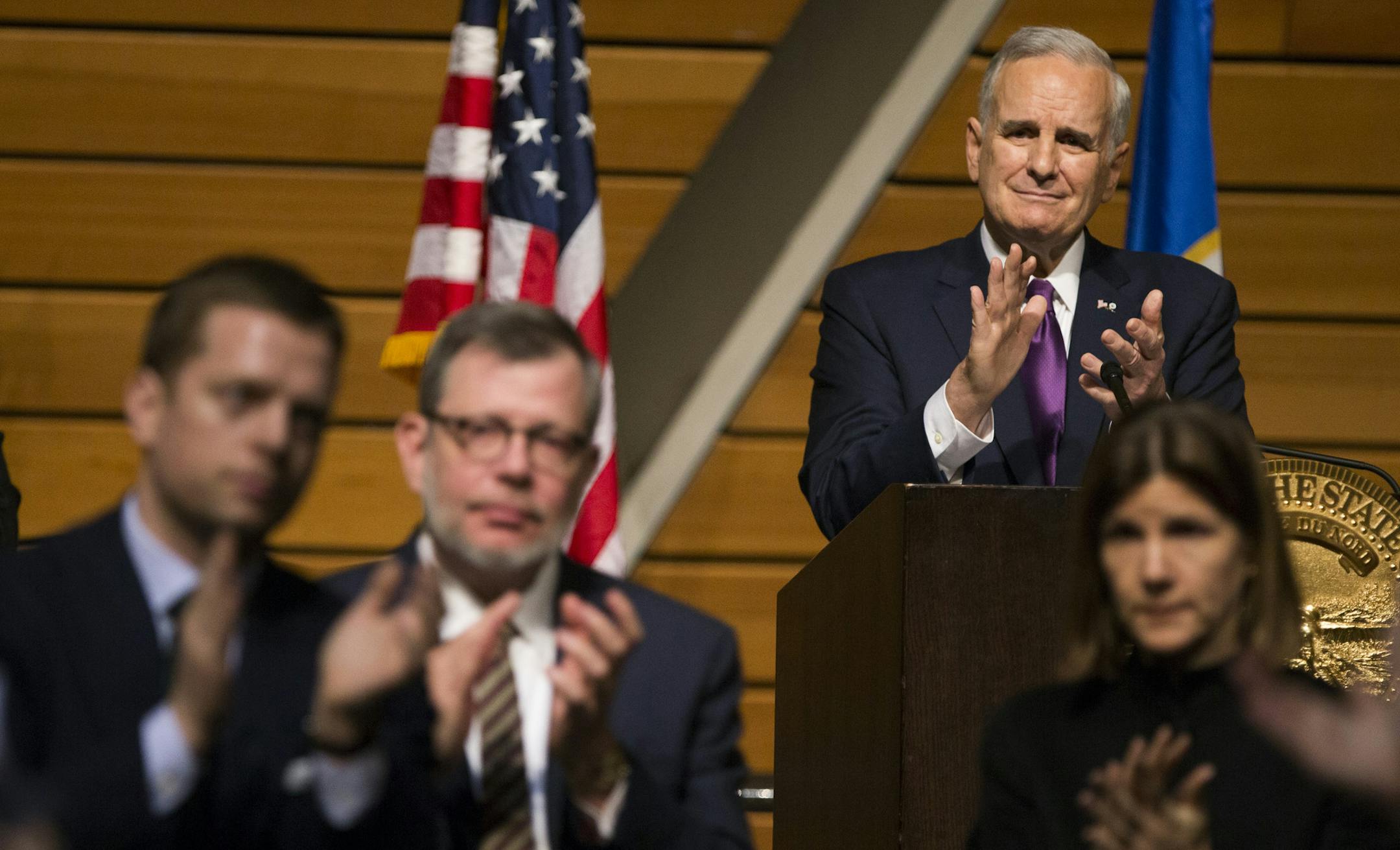 Gov. Mark Dayton, and other in attendance of the State of the State address, gave at standing ovation to Asma Jama who was mentioned in the speech at the University of Minnesota's McNamara Alumni Center on Wednesday, March 9, 2016, in Minneapolis, Minn. Jama was a victim of a hate crime in November when a woman smashed her face with a glass for not speaking English. ] RENEE JONES SCHNEIDER • reneejones@startribune.com
