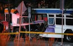A damaged Metro Transit bus could be seen as police investigated the scene. ] ANTHONY SOUFFLE ï anthony.souffle@startribune.com Police investigated t