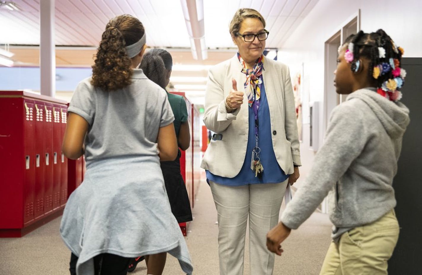 Principal Melisa Rivera gave students who were behaving and staying in an orderly line, a thumbs up, in the hallway during her walk in the morning of the first day of school on Tuesday.